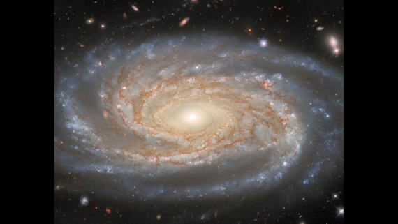 Hubble Space Telescope's mesmerizing views of enormous spiral galaxy could help solve one of the biggest mysteries in astronomy