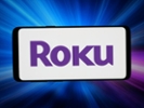 GERMANY - 2026/03/20: In this photo illustration, the logo of US video streaming platform company Roku Inc. is displayed on a smartphone in front of abstract background on computer screen. (Photo Illustration by Timon Schneider/SOPA Images/LightRocket via Getty Images)