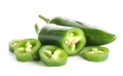Whole and sliced green jalapeno peppers isolated on white