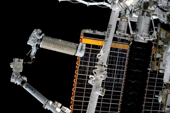 Astronauts deploy roll-out solar array on ISS