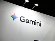The illuminated Google Gemini logo is displayed on a minimalist, sustainable glass monolith at the entrance of ''Android Avenue'' in Hall 3 during the Mobile World Congress in Barcelona, Spain, on March 5, 2026. The 2026 edition, themed ''The IQ Era,'' features Google showcasing the Gemini 2.0 multimodal architecture. The exhibit includes the integration of Gemini Nano with Multimodality across the new Google Pixel 10 and Pixel Fold 3 lineup, powered by the Google Tensor G5 (3nm) custom silicon. Demonstrations at the booth highlight Gemini's capabilities as a proactive personal agent, utilizing the 200-megapixel main sensor of the latest flagship devices for real-time visual reasoning and complex task automation via Android 16. The branding is accompanied by a showcase of Veo-powered AI video generation and the new Gemini Live voice interface, which facilitates natural, uninterrupted dialogue with the AI model. (Photo by Joan Cros/NurPhoto via Getty Images)