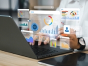 An analyst uses a computer and dashboard for data business analysis and Data Management System with KPI and metrics connected to the database for technology finance, operations, sales, marketing