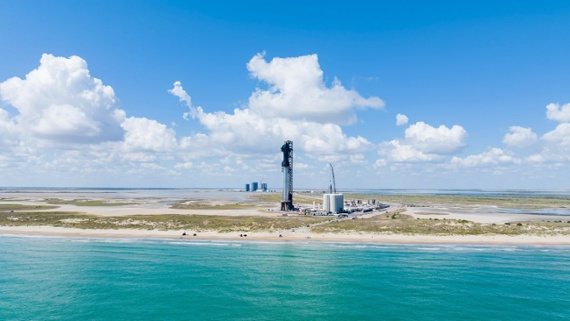 SpaceX's Starship vehicle towers above turquoise waters