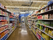 A worker stocks a shelf in a grocery aisle at a Walmart store on Black Friday in Columbus, Ohio, US, on Friday, Nov. 28, 2025. US consumers are heading into the official start of the holiday shopping season Friday with a host of economic concerns, including a cooling job market, stagnant wages, persistent inflation and the looming fallout from tariffs. Photographer: Brian Kaiser/Bloomberg via Getty Images