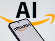 The Amazon.com logo is displayed on a mobile phone with artificial intelligence (AI) in the background, in this photo illustration in Brussels, Belgium, on October 28, 2025. (Photo Illustration by Jonathan Raa/NurPhoto via Getty Images)