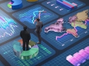 Two business professionals stand in a modern office, observing various digital displays showing graphs, charts, and data trends. They are engaged in a discussion about company performance.