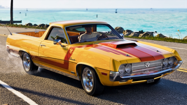 Jason riding a yellow car along the beach