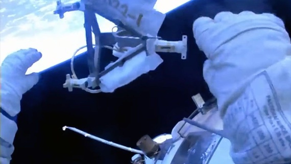 Cosmonauts toss equipment overboard on spacewalk
