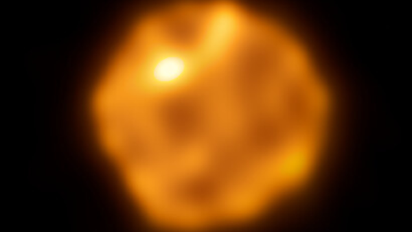 an orange mottled orb on a black background