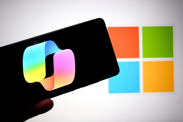 INDIA - 2026/03/12: In this photo illustration, a Microsoft Copilot logo is seen displayed on a smartphone with a Microsoft logo in the background. (Photo Illustration by Avishek Das/SOPA Images/LightRocket via Getty Images)