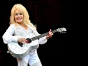 GLASTONBURY, ENGLAND - JUNE 29:  Dolly Parton performs on The Pyramid Stage on Day 3 of the Glastonbury Festival at Worthy Farm on June 29, 2014 in Glastonbury, England.  (Photo by Shirlaine Forrest/WireImage)