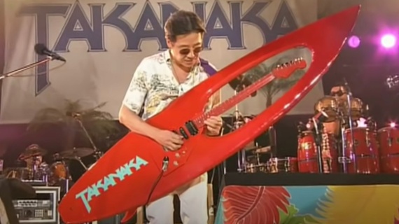 Watch Japanese fusion legend Masayoshi Takanaka shred on an awe-inspiring surfboard guitar