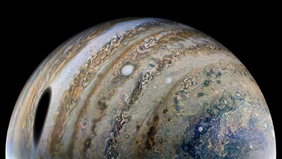 Shadow of Jupiter's largest moon looms in magnificent new Juno photo