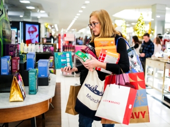 PARAMUS, NEW JERSEY - NOVEMBER 28: A person carries shopping bags during Black Friday shopping at Garden State Plaza on November 28, 2025 in Paramus, New Jersey. According to the the National Retail Federation, nearly 187 million people are expected to shop between Thanksgiving and Cyber Monday this year. (Photo by Eduardo Munoz Alvarez/Getty Images)