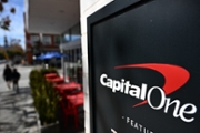 The Capital One bank logo is displayed outside of a Capital One Cafe location in Santa Monica, California on February 21, 2024. Capital One's proposed merger with the US credit card specialist Discover has reshuffled the deck in a fast-growing sector in the United States, where cash is gradually disappearing from the landscape. (Photo by Patrick T. Fallon / AFP) (Photo by PATRICK T. FALLON/AFP via Getty Images)