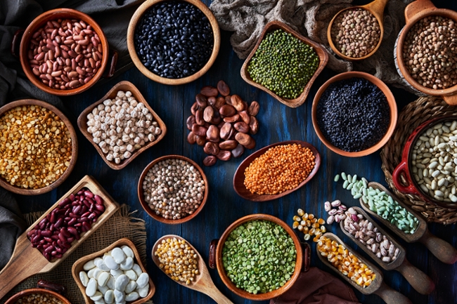 Legumes and beans on a rustic wooden table