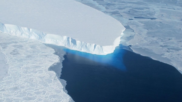 a sheet of ice on a blue sea