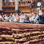 LONDON, UNITED KINGDOM - APRIL 26: A record-breaking tiramisu, measuring 440.58 meters, is displayed at Chelsea Old Town Hall in London, United Kingdom on April 26, 2026. Led by Italian entrepreneur Mirko Ricci and the London branch of the Federation of Italian Chefs, dozens of volunteers collaborated over two days to surpass the previous 273.5-meter record set in Milan in 2019. Guinness World Records official adjudicator Lorenzo Veltri verified the measurement on-site during the event, which was supported by the Italian Embassy and the Italian Cultural Institute. All proceeds from the organization were donated to the Esharelife Foundation to support efforts in combating poverty. (Photo by Muhammed Yaylali/Anadolu via Getty Images)