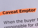 caveat emptor word highlighted on the white paper