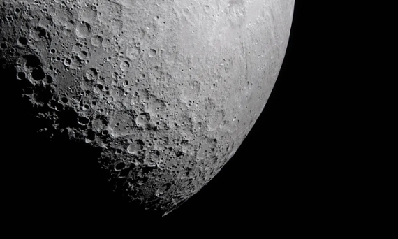 a grey orb dotted with craters