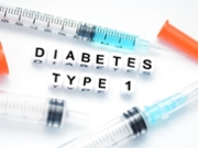 Blocks spell out "type 1" and "diabetes" amid syringes.