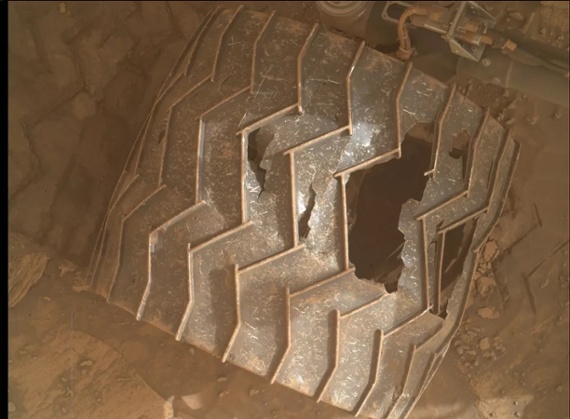 Mars has taken big bites out of the Curiosity rover's wheels