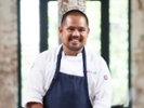 TOP CHEF -- "Adios Charleston, Hello James Beard" Episode 1411 -- Pictured: Sheldon Simeon -- (Photo by: Paul Cheney/Bravo/NBCU Photo Bank/NBCUniversal via Getty Images)