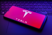 The Tesla, Inc. logo appears on a smartphone screen in this illustration photo in Reno, United States, on December 20, 2024. (Photo by Jaque Silva/NurPhoto via Getty Images)