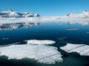 Panoramic view of ice pack with mountains on the background Svalbard Islnads