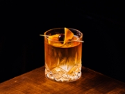 Alcoholic Old Fashioned Cocktail classic Bourbon Whiskey, sugar cube and aromatic bitters garnish with orange peel and a cherry