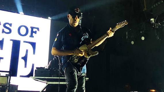 Watch Tom Morello get accidentally wiped out by a security guard in pursuit of a stage invader