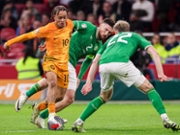 AMSTERDAM, NETHERLANDS - NOVEMBER 18: Xavi Simons of The Netherlands, Matt Doherty of Ireland, Nathan Collins of Ireland battle for the ball during the UEFA EURO 2024 Qualifying Round Group B match between Netherlands and Republic of Ireland at Johan Cruijff ArenA on November 18, 2023 in Amsterdam, Netherlands (Photo by Pieter van der Woude/ BSR Agency/Getty Images)