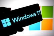 INDIA - 2025/07/14: In this photo illustration, a Windows 11 logo is seen displayed on a smartphone with a Microsoft logo in the background. (Photo Illustration by Avishek Das/SOPA Images/LightRocket via Getty Images)