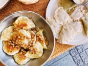 Variety of fried and boiled pierogi - traditional Polish dumplings