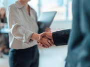Cropped shot of business people standing in a modern office, shaking hands after having a successful meeting and reaching an agreement. Welcoming new hire. Celebrating success and achievement.